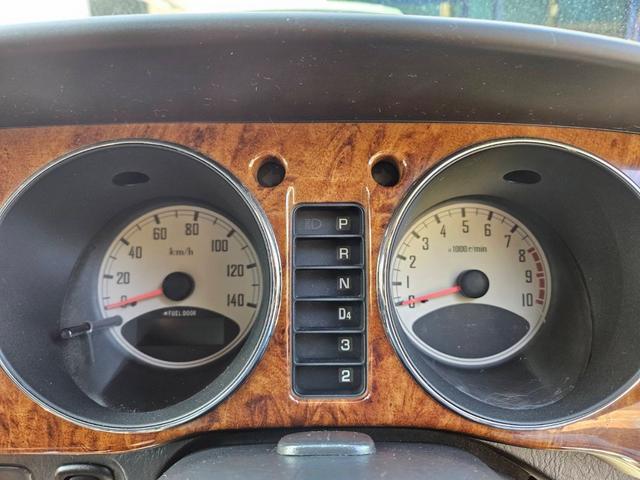 ミラジーノ ミニライトスペシャル　後期型　走行距離３１０００キロ　タイミングベルト＆ウォーターポンプ交換　純正レザー調黒シート　フォグ　Ｆリップ付　黒１４インチアルミ　国産タイヤ４本交換　ウッド調パネル　ウッドコンビハンドル　キーレス（12枚目）