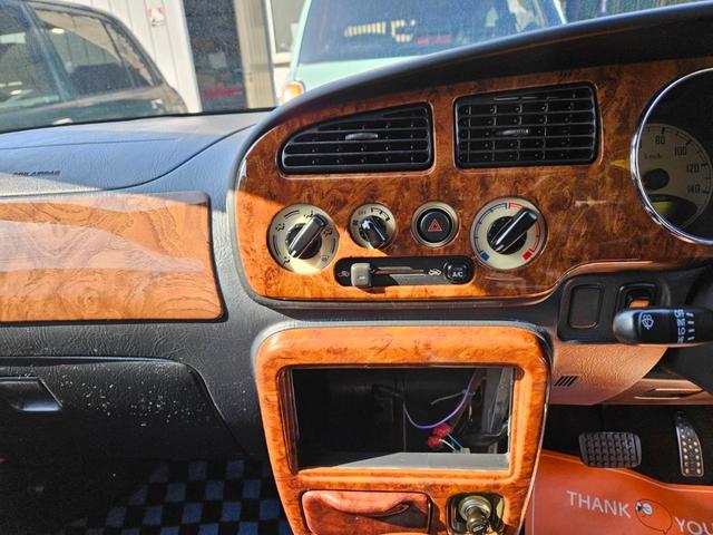 ミラジーノ ミニライトスペシャル　後期型　走行距離３１０００キロ　タイミングベルト＆ウォーターポンプ交換　純正レザー調黒シート　フォグ　Ｆリップ付　黒１４インチアルミ　国産タイヤ４本交換　ウッド調パネル　ウッドコンビハンドル　キーレス（15枚目）