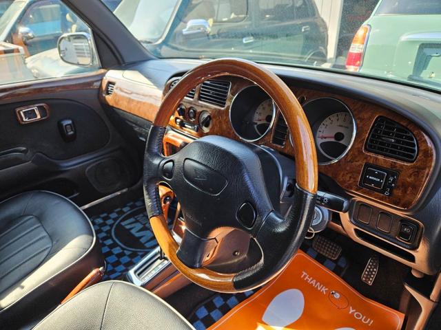 ミラジーノ ミニライトスペシャル　後期型　走行距離３１０００キロ　タイミングベルト＆ウォーターポンプ交換　純正レザー調黒シート　フォグ　Ｆリップ付　黒１４インチアルミ　国産タイヤ４本交換　ウッド調パネル　ウッドコンビハンドル　キーレス（36枚目）