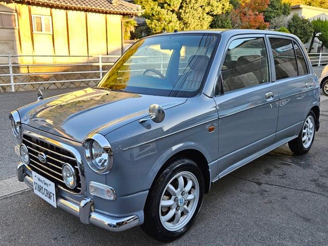 ミラジーノ ジーノターボ　色替グレー塗装済　ターボ　４ＷＤ　５速ミッション　タイミングベルト交換済　ブラウン革調シートカバー　ＣＤ　ＥＴＣ　ヘッドライトバイザー　ミニライトアルミ　フォグ　ウッドコンビハンドル　ウッド調パネル（5枚目）