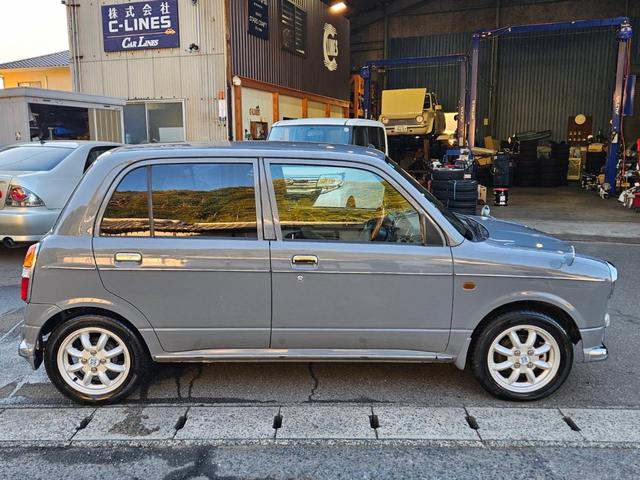 ミラジーノ ジーノターボ　色替グレー塗装済　ターボ　４ＷＤ　５速ミッション　タイミングベルト交換済　ブラウン革調シートカバー　ＣＤ　ＥＴＣ　ヘッドライトバイザー　ミニライトアルミ　フォグ　ウッドコンビハンドル　ウッド調パネル（7枚目）