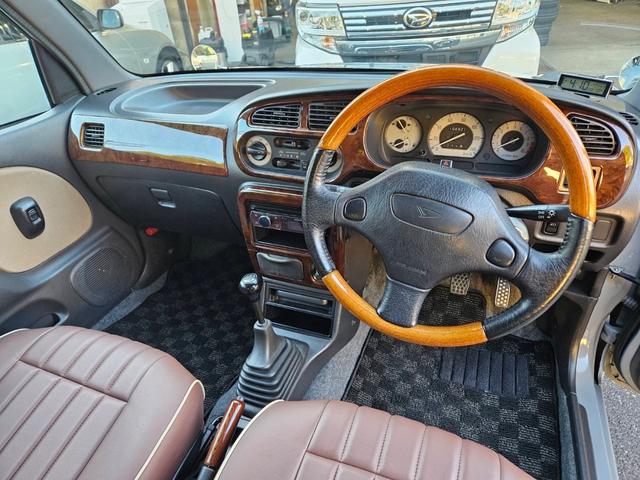 ミラジーノ ジーノターボ　色替グレー塗装済　ターボ　４ＷＤ　５速ミッション　タイミングベルト交換済　ブラウン革調シートカバー　ＣＤ　ＥＴＣ　ヘッドライトバイザー　ミニライトアルミ　フォグ　ウッドコンビハンドル　ウッド調パネル（13枚目）