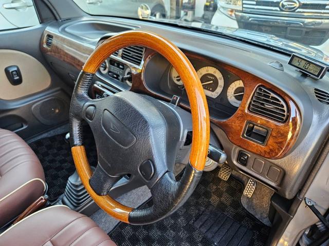 ミラジーノ ジーノターボ　色替グレー塗装済　ターボ　４ＷＤ　５速ミッション　タイミングベルト交換済　ブラウン革調シートカバー　ＣＤ　ＥＴＣ　ヘッドライトバイザー　ミニライトアルミ　フォグ　ウッドコンビハンドル　ウッド調パネル（42枚目）