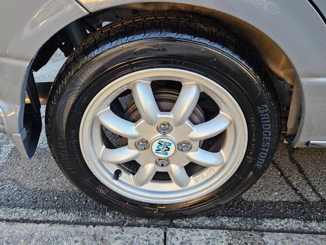 ミラジーノ ジーノターボ　色替グレー塗装済　ターボ　４ＷＤ　５速ミッション　タイミングベルト交換済　ブラウン革調シートカバー　ＣＤ　ＥＴＣ　ヘッドライトバイザー　ミニライトアルミ　フォグ　ウッドコンビハンドル　ウッド調パネル（45枚目）