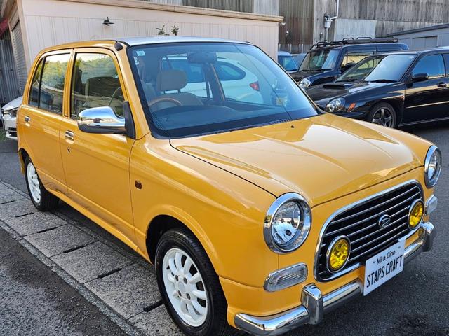 ミラジーノ ジーノ 色替イエロー&ルーフホワイトツートン タイミングベルト・ウォーターポンプ交換 国産新品タイヤ付 ホワイト13アルミ 走行56000キロ キーレス ウッドコンビハンドル オートマ フル装備(3枚目)