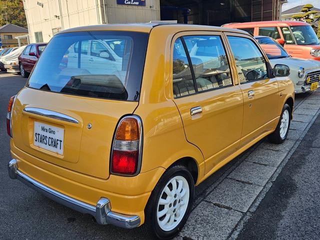 ミラジーノ ジーノ 色替イエロー&ルーフホワイトツートン タイミングベルト・ウォーターポンプ交換 国産新品タイヤ付 ホワイト13アルミ 走行56000キロ キーレス ウッドコンビハンドル オートマ フル装備(8枚目)