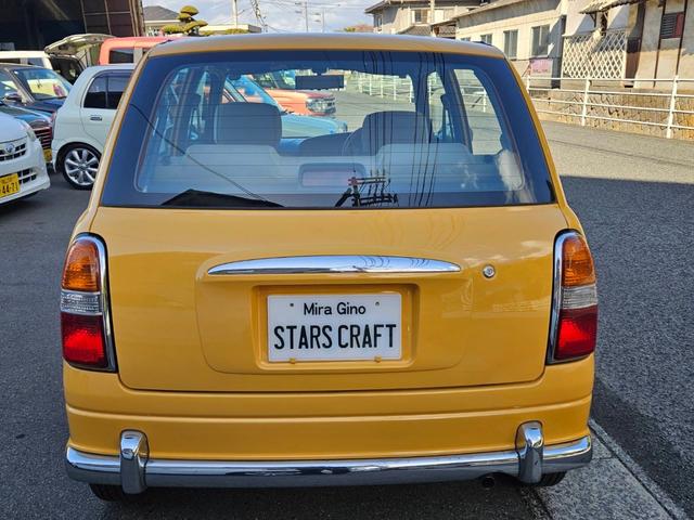 ミラジーノ ジーノ 色替イエロー&ルーフホワイトツートン タイミングベルト・ウォーターポンプ交換 国産新品タイヤ付 ホワイト13アルミ 走行56000キロ キーレス ウッドコンビハンドル オートマ フル装備(9枚目)