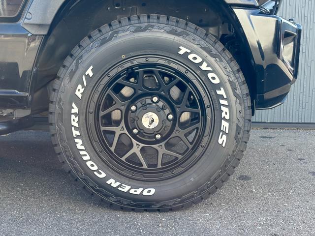 ジムニー XC グレッディマフラー シートカバー ナビ バックモニター ロッソモデロ トーヨータイヤオープンカントリー(15枚目)