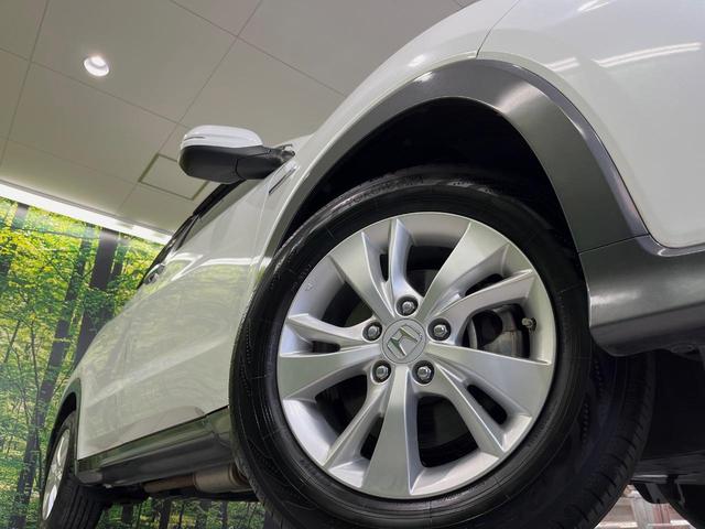 ヴェゼル ハイブリッドX・ホンダセンシング 純正ナビ バックカメラ 衝突軽減装置 ドラレコ ETC レーダークルーズ LEDヘッド パドルシフト ステアリングスイッチ 純正16インチアルミ オートライト オートエアコン 車線逸脱警報 禁煙車(13枚目)