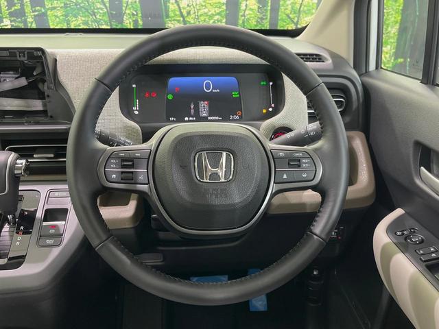 フリード e:HEVエアー EX 登録済未使用車 両側電動スライドドア 衝突軽減装置 レーダークルーズ ハーフレザーシート 前席シートヒーター コーナーセンサー スマートキー LEDヘッドライト オートマチックハイビーム 車線逸脱警報(11枚目)