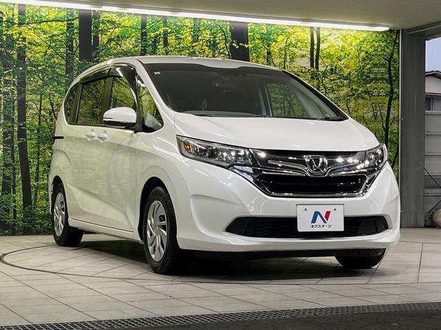 フリード G・ホンダセンシング 純正9型ナビ バックカメラ 後席モニター 両側電動スライドドア 衝突軽減装置 レーダークルーズ 禁煙車 前後ドラレコ スマートキー ETC 車線逸脱警報 オートライト オートエアコン 横滑り防止装置(16枚目)