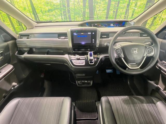 フリード+ハイブリッド ハイブリッドEX メーカー純正ナビ バックカメラ 衝突軽減装置 レーダークルーズ 両側電動スライドドア ハーフレザーシート LEDヘッド 前席シートヒーター ETC スマートキー ステアリングスイッチ オートエアコン(2枚目)