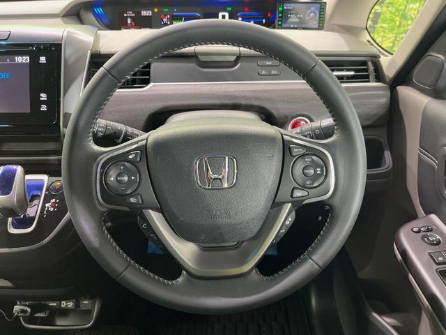 フリード+ハイブリッド ハイブリッドEX メーカー純正ナビ バックカメラ 衝突軽減装置 レーダークルーズ 両側電動スライドドア ハーフレザーシート LEDヘッド 前席シートヒーター ETC スマートキー ステアリングスイッチ オートエアコン(11枚目)