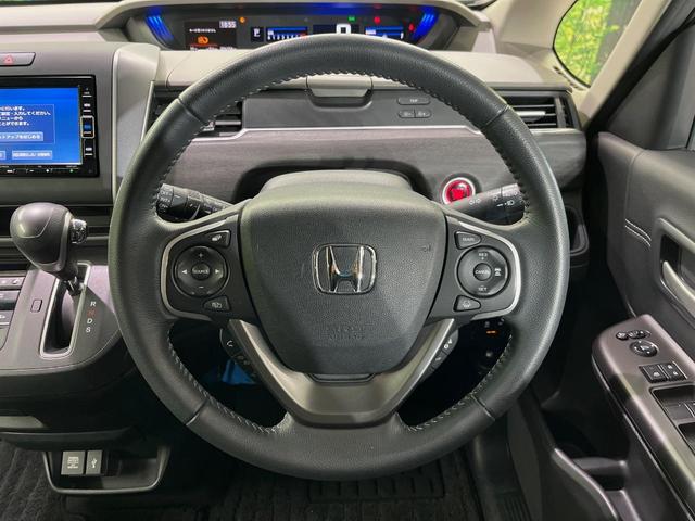 フリード Ｇ・ホンダセンシング　純正ナビ　バックカメラ　衝突言軽減装置　両側電動スライドドア　レーダークルーズ　禁煙車　ＬＥＤヘッド　革巻きステアリング　純正１５インチアルミ　シートヒーター　ＥＴＣ　スマートキー　車線逸脱警報（11枚目）