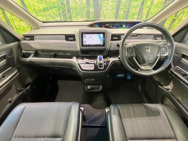 フリードハイブリッド ハイブリッド・ＥＸ　純正ＳＤナビ　バックカメラ　衝突軽減装置　アダプティブクルーズコントロール　ハーフレザーシート　ドラレコ　スマートキー　ＬＥＤヘッド　ＥＴＣ　純正１５インチアルミ　前席シートヒーター　禁煙車（2枚目）