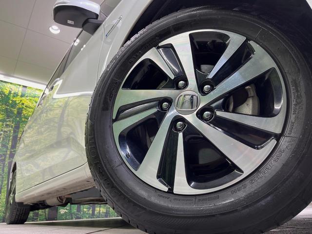 フリードハイブリッド ハイブリッド・ＥＸ　純正ＳＤナビ　バックカメラ　衝突軽減装置　アダプティブクルーズコントロール　ハーフレザーシート　ドラレコ　スマートキー　ＬＥＤヘッド　ＥＴＣ　純正１５インチアルミ　前席シートヒーター　禁煙車（12枚目）