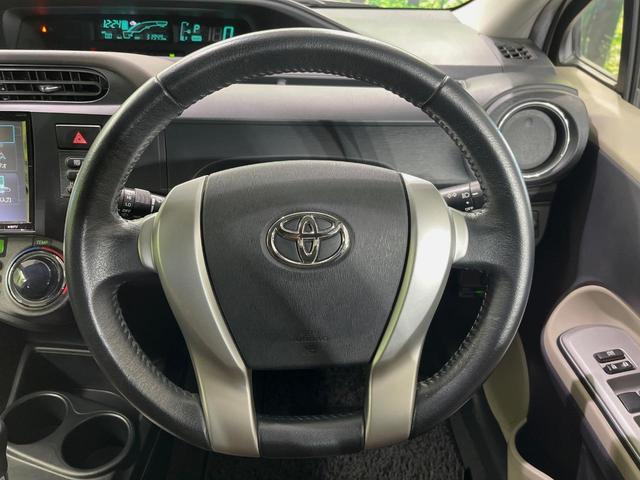 アクア Ｇ　８型ＢＩＧ－Ｘナビ　バックカメラ　禁煙車　スマートキー　ＥＴＣ　オートライト　オートエアコン　革巻きハンドル　電動格納ミラー　パワーウィンドウ　盗難防止装置　プライバシーガラス　横滑り防止装置（11枚目）