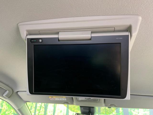 ハイブリッドG クエロ 禁煙車 純正SDナビ フリップダウンモニター 両側電動ドア ハーフレザー LEDヘッド バックカメラ ETC Bluetooth再生 純正16インチアルミ スマートキー 7人乗り(6枚目)