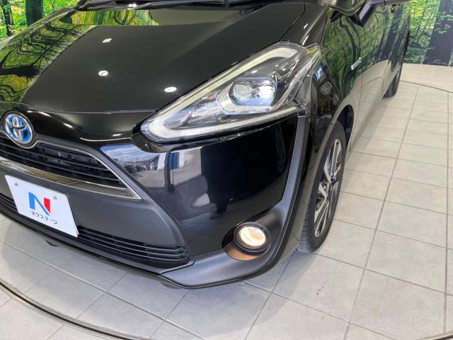 ハイブリッドG クエロ 禁煙車 純正SDナビ フリップダウンモニター 両側電動ドア ハーフレザー LEDヘッド バックカメラ ETC Bluetooth再生 純正16インチアルミ スマートキー 7人乗り(14枚目)
