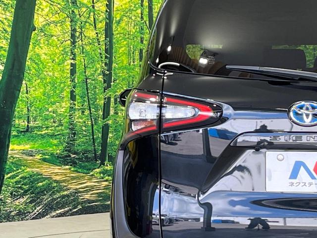 ハイブリッドG クエロ 禁煙車 純正SDナビ フリップダウンモニター 両側電動ドア ハーフレザー LEDヘッド バックカメラ ETC Bluetooth再生 純正16インチアルミ スマートキー 7人乗り(58枚目)