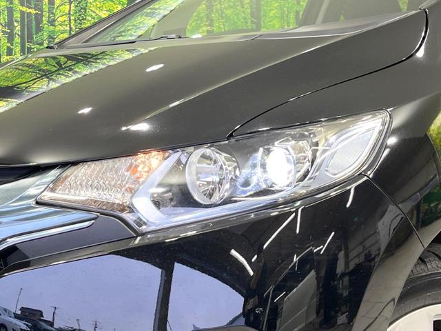 フィットハイブリッド Lパッケージ 4WD 純正SDナビ バックカメラ 禁煙車 ハーフレザーシート ドラレコ スマートキー LEDヘッド ビルトインETC クルコン 純正15インチアルミ オートライト オートエアコン(12枚目)