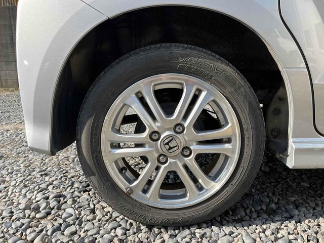 N-BOXカスタム G・Lパッケージ ETC 両側スライド・片側電動 ナビ TV HID スマートキー アイドリングストップ 電動格納ミラー ベンチシート CVT 盗難防止システム ABS ESC CD DVD再生 アルミホイール(22枚目)