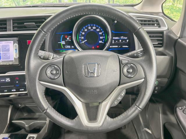 フィットハイブリッド Ｌパッケージ　純正ナビ　バックカメラ　衝突軽減　禁煙車　クルコン　ＥＴＣ　ＨＩＤヘッド　Ｂｌｕｅｔｏｏｔｈ　スマートキー　電動格納ミラー　オートライト　オートエアコン　横滑り防止（11枚目）