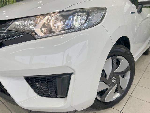 フィットハイブリッド Ｌパッケージ　純正ナビ　バックカメラ　衝突軽減　禁煙車　クルコン　ＥＴＣ　ＨＩＤヘッド　Ｂｌｕｅｔｏｏｔｈ　スマートキー　電動格納ミラー　オートライト　オートエアコン　横滑り防止（12枚目）