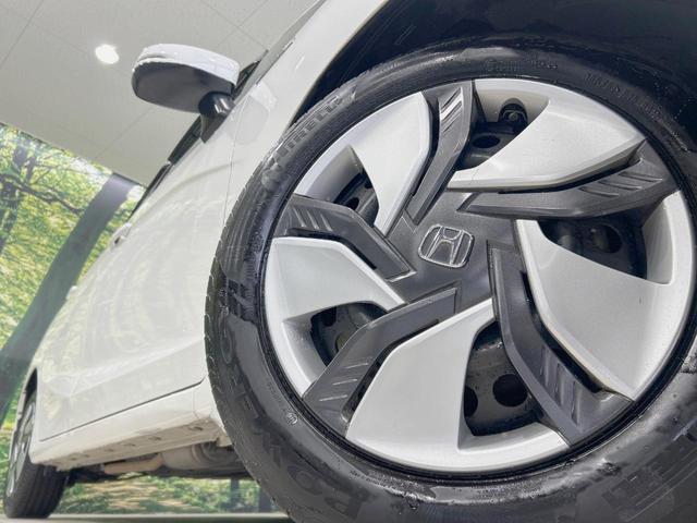フィットハイブリッド Ｌパッケージ　純正ナビ　バックカメラ　衝突軽減　禁煙車　クルコン　ＥＴＣ　ＨＩＤヘッド　Ｂｌｕｅｔｏｏｔｈ　スマートキー　電動格納ミラー　オートライト　オートエアコン　横滑り防止（13枚目）