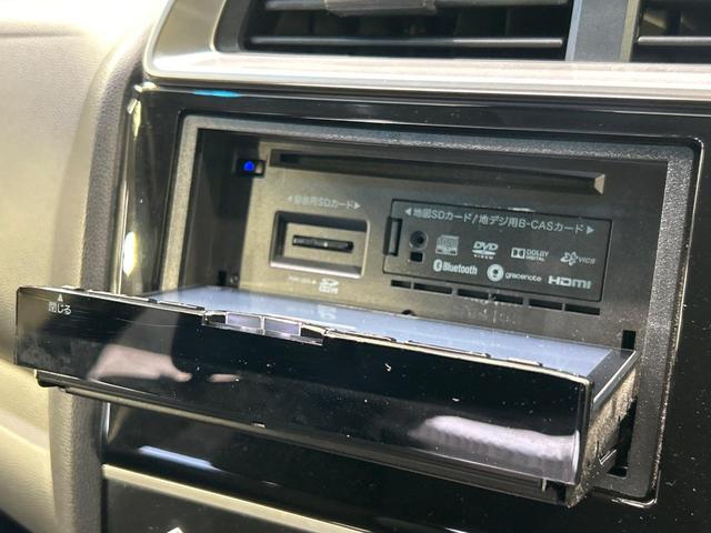 フィット 13G・Fパッケージ SDナビ バックカメラ?シティブレーキアクティブシステム 禁煙車 前後ドライブレコーダー スマートキー ETC Bluetooth再生 CD/DVD再生 フルセグ ステアリングスイッチ(34枚目)