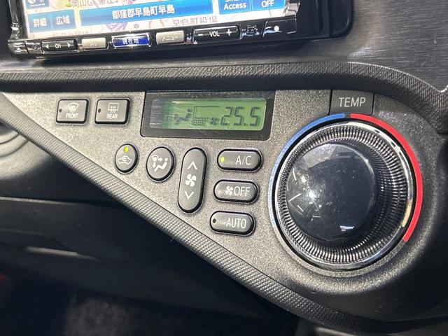 アクア G SDナビ スマートキー ETC オートライト オートエアコン 純正15インチアルミ CD/DVD再生 革巻きステアリング 電動格納ミラー(6枚目)