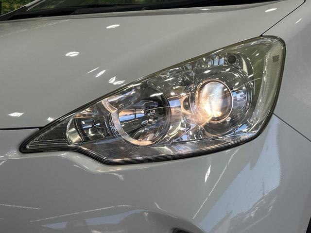 アクア G SDナビ スマートキー ETC オートライト オートエアコン 純正15インチアルミ CD/DVD再生 革巻きステアリング 電動格納ミラー(12枚目)