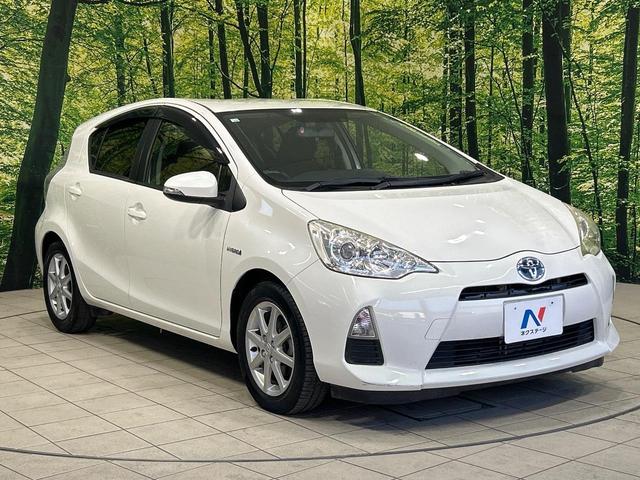 アクア G SDナビ スマートキー ETC オートライト オートエアコン 純正15インチアルミ CD/DVD再生 革巻きステアリング 電動格納ミラー(16枚目)