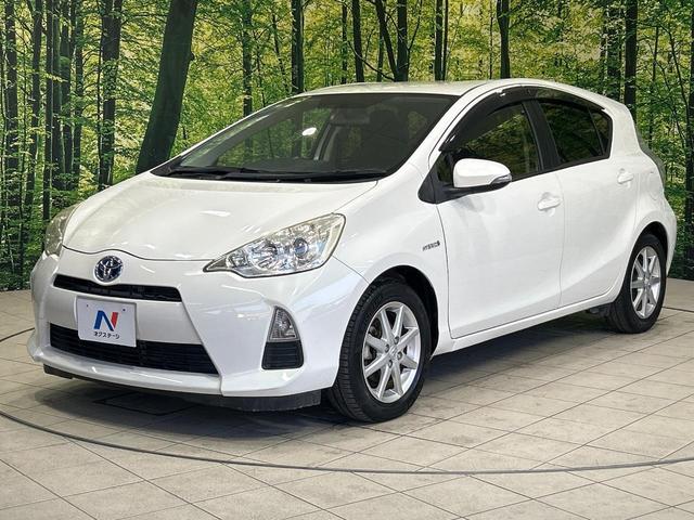 アクア G SDナビ スマートキー ETC オートライト オートエアコン 純正15インチアルミ CD/DVD再生 革巻きステアリング 電動格納ミラー(17枚目)