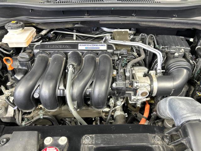 ヴェゼル ハイブリッドＺ・ホンダセンシング　後期　純正８型ナビ　バックカメラ　シ－トヒ－タ－　ハ－フレザ－シ－ト　ホンダセンシング　アダプティブクルーズコントロール　ＬＥＤヘッドライト　Ｂｌｕｅｔｏｏｔｈ　禁煙車　ワンオーナー（18枚目）