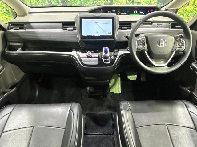 フリードハイブリッド ハイブリッド・Gホンダセンシング 純正9型ナビ バックカメラ 両側パワスラ ホンダセンシング アダプティブクルーズコントロール ドラレコ ETC LEDヘッドライト Bluetooth 革調シートカバー 禁煙車 ワンオーナー(2枚目)