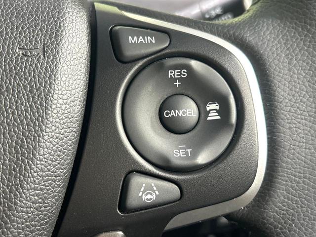 フリードハイブリッド ハイブリッド・Gホンダセンシング 純正9型ナビ バックカメラ 両側パワスラ ホンダセンシング アダプティブクルーズコントロール ドラレコ ETC LEDヘッドライト Bluetooth 革調シートカバー 禁煙車 ワンオーナー(7枚目)