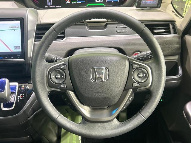 フリードハイブリッド ハイブリッド・Gホンダセンシング 純正9型ナビ バックカメラ 両側パワスラ ホンダセンシング アダプティブクルーズコントロール ドラレコ ETC LEDヘッドライト Bluetooth 革調シートカバー 禁煙車 ワンオーナー(12枚目)