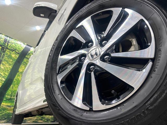 フリードハイブリッド ハイブリッド・Gホンダセンシング 純正9型ナビ バックカメラ 両側パワスラ ホンダセンシング アダプティブクルーズコントロール ドラレコ ETC LEDヘッドライト Bluetooth 革調シートカバー 禁煙車 ワンオーナー(13枚目)