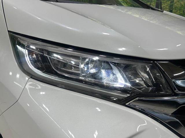 フリードハイブリッド ハイブリッド・Gホンダセンシング 純正9型ナビ バックカメラ 両側パワスラ ホンダセンシング アダプティブクルーズコントロール ドラレコ ETC LEDヘッドライト Bluetooth 革調シートカバー 禁煙車 ワンオーナー(14枚目)