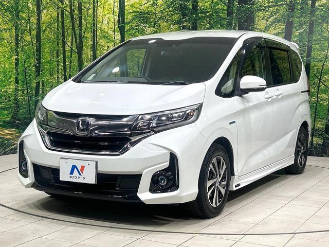フリードハイブリッド ハイブリッド・Gホンダセンシング 純正9型ナビ バックカメラ 両側パワスラ ホンダセンシング アダプティブクルーズコントロール ドラレコ ETC LEDヘッドライト Bluetooth 革調シートカバー 禁煙車 ワンオーナー(17枚目)