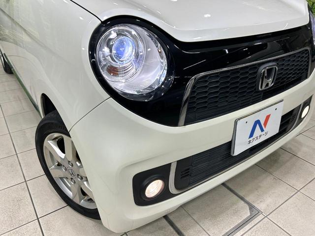 Ｎ－ＯＮＥ プレミアム・Ｌパッケージ　禁煙車　ナビ　バックカメラ　ＨＩＤヘッドライト　スマートキー　オートライト　オートエアコン　ＣＤ／ＤＶＤ再生　革巻きステアリング　フォグライト　地デジ　プライバシーガラス　ワンオーナー（11枚目）