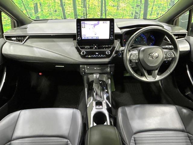 カローラツーリング ハイブリッド　ダブルバイビー　純正９型ナビ　バックカメラ　シ－トヒ－タ－　ハ－フレザ－シ－ト　セ－フティセンス　レーダークルーズコントロール　ＢＳＭ　ドラレコ　ＥＴＣ　ＬＥＤヘッドライト　Ｂｌｕｅｔｏｏｔｈ　禁煙車　ワンオーナー（2枚目）