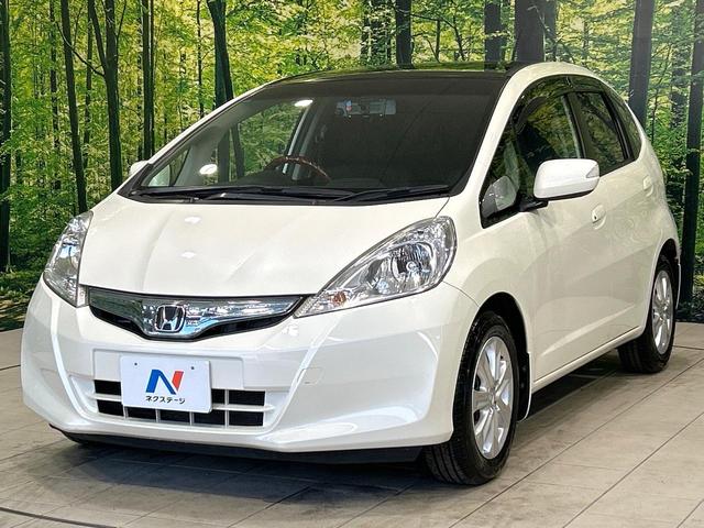 フィットハイブリッド ナビプレミアムセレクション　ガラスル－フ　純正ナビ　バックカメラ　クルーズコントロール　シ－トヒ－タ－　ＨＩＤヘッドライト　ＥＴＣ　純正１５インチＡＷ　スマートキー　パドルシフト　オートエアコン　ＣＤ／ＤＶＤ再生　地デジ　禁煙車（21枚目）