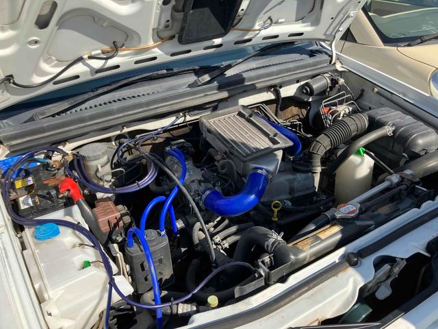 ジムニー Ｊ２　インタークーラーターボ　ＥＴＣ　キーレスエントリー　５速マニュアル（ＭＴ）　ＣＤ　リフトアップ　アルミホイール　衝突安全ボディ　エアバッグ（19枚目）