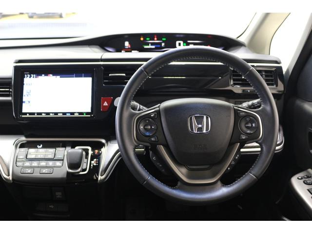 ステップワゴンスパーダ ｅ：ＨＥＶスパーダＧ・ＥＸホンダセンシング　ナビ　後席モニター　バックカメラ　ＥＴＣ　ドライブレコーダー　充電用ＵＳＢジャック　わくわくゲート　シートヒーター　シートバックテーブル　クルーズコントロール　アルミホイール　３列シート７人乗り（11枚目）