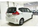 フリードハイブリッド ハイブリッド・EX Sパッケージ ホンダセンシング 横滑り防止装置 ホンダインターナビ ETC 充電用USBジャック LEDヘッドライト シートヒーター パワースライドドア クルーズコントロール アルミホイール 6人乗り(7枚目)