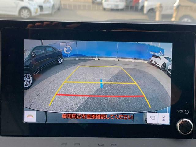 プリウス Ｘ　ワンオーナー　禁煙　モデリスタＡＷ　ナビ　フルセグ　Ｂｌｕｅｔｏｏｔｈ　バックモニター　前後ドラレコ　レーダークルーズ　ＥＴＣ　レーダー探知機　ＢＳＭ　ＡＣ１００Ｖ　レザー調シートカバー　オートＨＢ（7枚目）