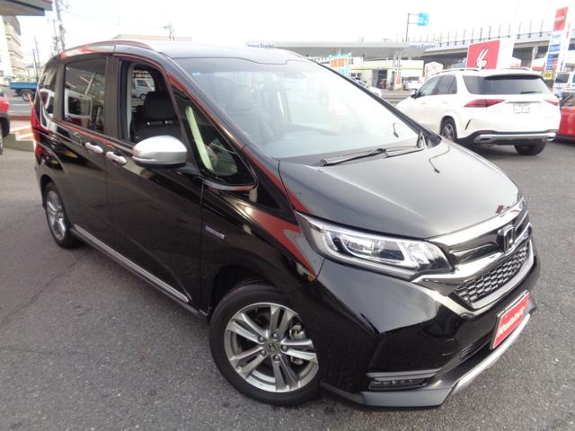 フリード＋ハイブリッド ハイブリッド・クロスターホンダセンシング　スマートキー・ＤＯＰ９インチナビＴＶ・Ｂカメラ・ＢＴ・両側パワスラ・純１６インチＡＷ・アダプティブクルーズ・ＬＥＤライト・無限シフトノブ・ルーフラック・前後ドラレコ・シートヒーター・ワンオーナー（2枚目）