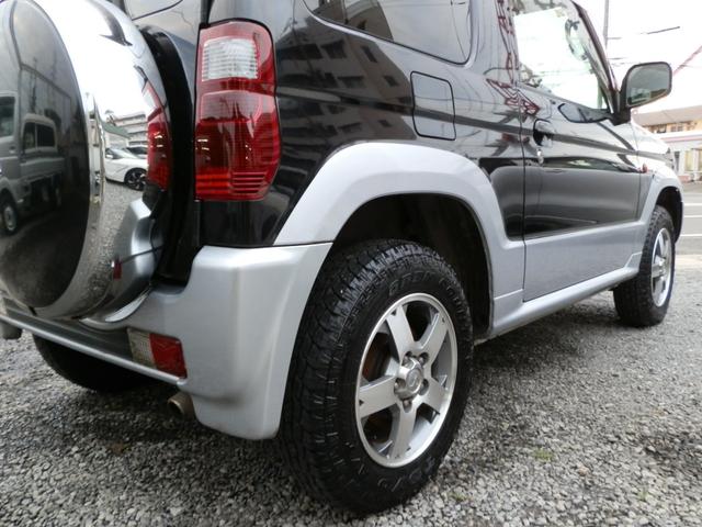 パジェロミニ アクティブフィールドエディション　４ＷＤ　ターボ　ナビＴＶ　禁煙車　キーレス　電動格納ミラー　リアスポイラー　フォグランプ　純正アルミホイール（64枚目）